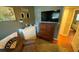 Bedroom showcasing a daybed, chest of drawers, and stylish decor at 2648 Amsden Rd, Winter Park, FL 32792