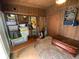 Mudroom with storage containers, a storage bench, and a view into the house at 2648 Amsden Rd, Winter Park, FL 32792