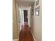 Hallway with wood floors and neutral paint at 2648 Amsden Rd, Winter Park, FL 32792