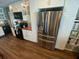 A modern kitchen features stainless steel appliances, white cabinetry, and butcher block countertops offering style and practicality at 2648 Amsden Rd, Winter Park, FL 32792