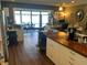 Open kitchen featuring butcher block counters, stainless steel refrigerator, and views of the adjacent dining and office areas at 2648 Amsden Rd, Winter Park, FL 32792