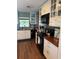 The updated kitchen features ample cabinet space, dark countertops, and stainless appliances at 2648 Amsden Rd, Winter Park, FL 32792