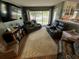 Relaxing living room featuring comfortable seating, a floral rug, and natural light creates a welcoming space at 2648 Amsden Rd, Winter Park, FL 32792