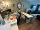 A well-lit home office with dual desks, organized storage, and comfortable seating offers a productive workspace at 2648 Amsden Rd, Winter Park, FL 32792