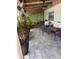 Covered patio with flagstone pavers and outdoor seating at 2648 Amsden Rd, Winter Park, FL 32792