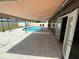 An outdoor pool with a covered patio and open access to the main house is perfect for relaxation and entertainment at 2648 Amsden Rd, Winter Park, FL 32792