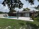 Backyard pool with a paved patio area, an open-air canopy and an outdoor seating area at 2648 Amsden Rd, Winter Park, FL 32792