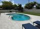Beautiful backyard pool with a paver deck, lounge chairs, and mature trees at 2648 Amsden Rd, Winter Park, FL 32792