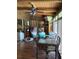 Cozy sunroom featuring a dining table, wood paneling, and natural light at 2648 Amsden Rd, Winter Park, FL 32792