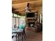 Bright sunroom with a brick fireplace, tv, and comfortable seating at 2648 Amsden Rd, Winter Park, FL 32792