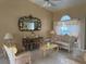 Living room with neutral paint, light tile flooring, and elegant furnishings at 2693 Maxwell W Ct, Kissimmee, FL 34743