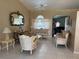 Cozy living room featuring a ceiling fan, tile floors and lots of natural light at 2693 Maxwell W Ct, Kissimmee, FL 34743