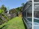 Backyard view of the home's pool in screened-in enclosure at 2693 Maxwell W Ct, Kissimmee, FL 34743