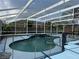 The property features a private in ground swimming pool with a screened enclosure at 2693 Maxwell W Ct, Kissimmee, FL 34743