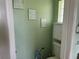Powder room featuring a toilet and wall cabinet at 2693 Maxwell W Ct, Kissimmee, FL 34743