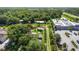 Aerial view of the property, showing the home's setting, lot boundaries, and nearby commercial buildings at 2915 Dean Ridge Rd, Orlando, FL 32825