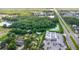 Bird's-eye view of the neighborhood showcasing lakes, green spaces, and commercial and residential zones nearby at 2915 Dean Ridge Rd, Orlando, FL 32825