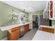 Updated kitchen featuring quartz countertops, modern appliances, floating shelves, and patterned tile flooring at 2915 Dean Ridge Rd, Orlando, FL 32825