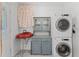Laundry room featuring washer and dryer, unique sink, decorative tiling, and shiplap walls at 2915 Dean Ridge Rd, Orlando, FL 32825