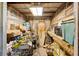 Interior view of the shed, filled with a variety of tools and equipment, and workbench at 2915 Dean Ridge Rd, Orlando, FL 32825