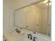 Elegant bathroom with double vanity and a lighted mirror reflecting details at 3030 Clubview Dr # Ge, Orlando, FL 32822