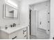 Bathroom with modern vanity, updated faucet, and stylish tile flooring, conveniently located near laundry at 3030 Clubview Dr # Ge, Orlando, FL 32822