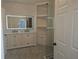 Well-lit bathroom features double vanity, modern mirror, and glass shower at 3030 Clubview Dr # Ge, Orlando, FL 32822