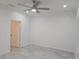 Spacious bedroom with a ceiling fan, recessed lighting, and modern tile flooring at 3030 Clubview Dr # Ge, Orlando, FL 32822