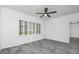 Bedroom with shuttered windows, ceiling fan and gray tile flooring at 3030 Clubview Dr # Ge, Orlando, FL 32822