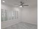 Bright bedroom features a modern ceiling fan and sleek, tiled flooring at 3030 Clubview Dr # Ge, Orlando, FL 32822