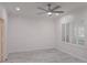 Bright and airy bedroom with stylish gray tile flooring, a ceiling fan and plantation shutters at 3030 Clubview Dr # Ge, Orlando, FL 32822