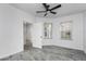 Inviting bedroom featuring a ceiling fan, tile flooring, and ample natural light from two windows at 3030 Clubview Dr # Ge, Orlando, FL 32822