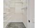 Spacious walk-in closet with wire shelving and gray tile flooring at 3030 Clubview Dr # Ge, Orlando, FL 32822