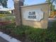 Sign for the 'Club House' amidst well-maintained landscaping, indicating community and recreational facilities at 3030 Clubview Dr # Ge, Orlando, FL 32822