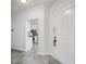 A bright entryway showcases modern tile flooring leading into an open-concept living space at 3030 Clubview Dr # Ge, Orlando, FL 32822