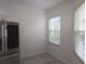 Bright kitchen corner featuring stainless steel appliances, tile floor, and natural light at 3030 Clubview Dr # Ge, Orlando, FL 32822
