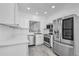 Modern kitchen with stainless steel appliances, white cabinets, and a convenient layout at 3030 Clubview Dr # Ge, Orlando, FL 32822