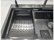 Stainless steel kitchen sink with integrated accessories for streamlined food preparation at 3030 Clubview Dr # Ge, Orlando, FL 32822