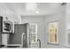 Modern kitchen with stainless steel appliances and bright natural light at 3030 Clubview Dr # Ge, Orlando, FL 32822