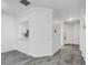 Open floor plan with kitchen pass-through and modern tile flooring at 3030 Clubview Dr # Ge, Orlando, FL 32822
