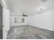 Spacious living room featuring a ceiling fan and a window with white shutters at 3030 Clubview Dr # Ge, Orlando, FL 32822