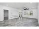 Living room with large windows, ceiling fan and gray tile floor at 3030 Clubview Dr # Ge, Orlando, FL 32822
