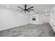 Living room with large windows, ceiling fan and gray tile floor at 3030 Clubview Dr # Ge, Orlando, FL 32822