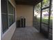 Screened-in patio with tile floors, and a view of the surrounding landscape, enhancing the outdoor living space at 3030 Clubview Dr # Ge, Orlando, FL 32822