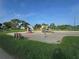 A vibrant playground with slides, swings, and climbing structures set in a well-maintained grassy area at 3030 Clubview Dr # Ge, Orlando, FL 32822