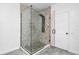 Modern bathroom with a glass-enclosed shower and stylish tile accents at 3030 Clubview Dr # Ge, Orlando, FL 32822