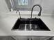 Deep kitchen sink features a modern faucet and sleek design at 3030 Clubview Dr # Ge, Orlando, FL 32822