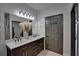 Bathroom with a double sink vanity and a large mirror, providing a spacious and functional area at 3176 Feltrim Pl # 302, Kissimmee, FL 34747