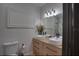 Bathroom featuring double sinks, modern fixtures and marble shower at 3176 Feltrim Pl # 302, Kissimmee, FL 34747