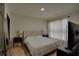 Serene bedroom with neutral tones, plush bedding, and ample natural light for relaxation at 3176 Feltrim Pl # 302, Kissimmee, FL 34747